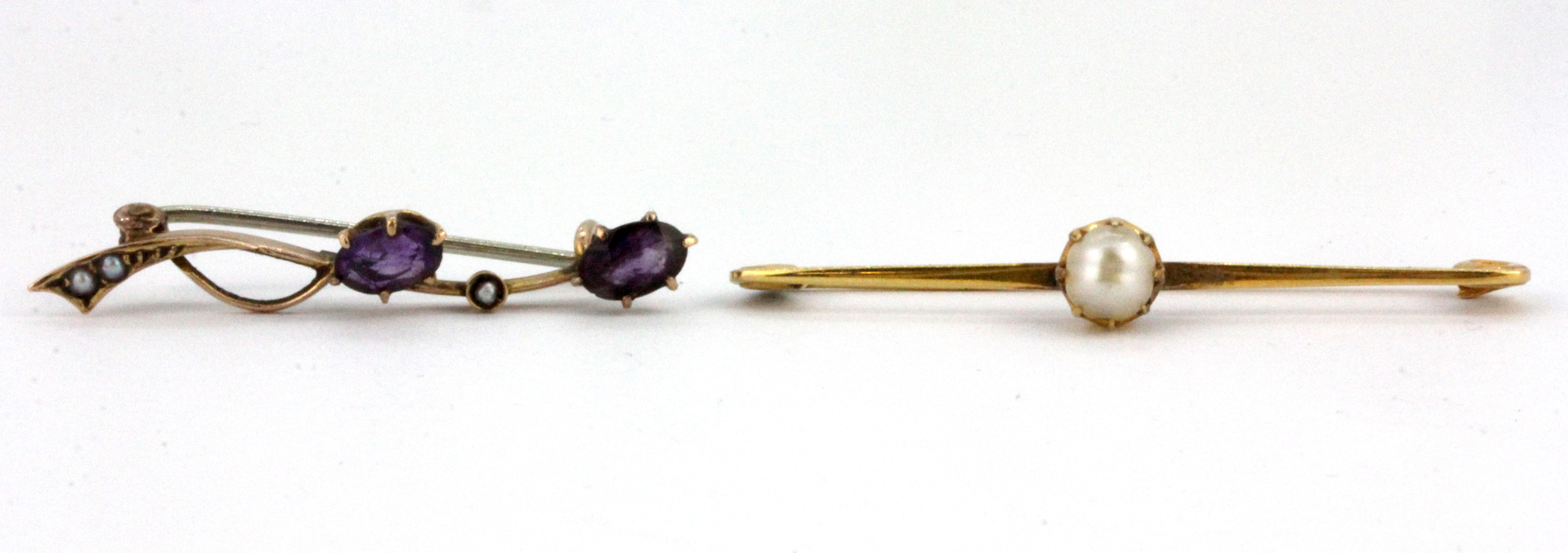 Two 9ct yellow gold brooches, set with amethysts and pearls, L. 3.5 & 4cm.