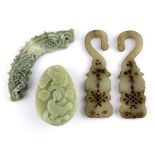A group of four old Chinese carved nephrite jade items, hook L. 10cm.
