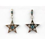 A pair of 18ct white gold (stamped 750) star shaped drop earrings set with brilliant cut diamonds
