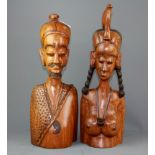 An Indonesian carved hibiscus wood mask and two further hardwood figures, tallest H. 42cm.