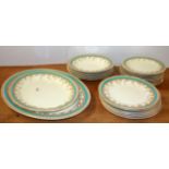 An early 20th century Royal Worcester part dinner service comprising two meat plates, five soup