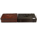 A Black Forest carved wooden box, 31 x 18 x 7cm together with a tooled leather cigarette box.