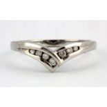 A 9ct white gold diamond set wishbone ring, (N).
