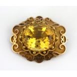 A yellow metal (tested high carat gold) brooch set with a large citrine, 3.3 x 2.8cm.