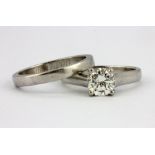 A 950 platinum brilliant cut diamond solitaire ring and matching wedding ring, with valuation for