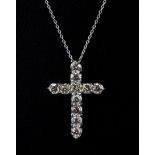 An 18ct white gold (stamped 750) diamond set cross pendant and chain, approx. 2.75ct, L. 3cm.