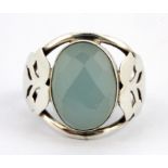A 925 silver ring set with a blue faceted stone, (Q).