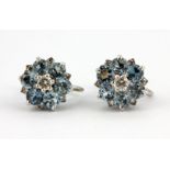 A pair of white metal (tested 9ct gold) aquamarine and diamond set earrings, dia. 1cm.