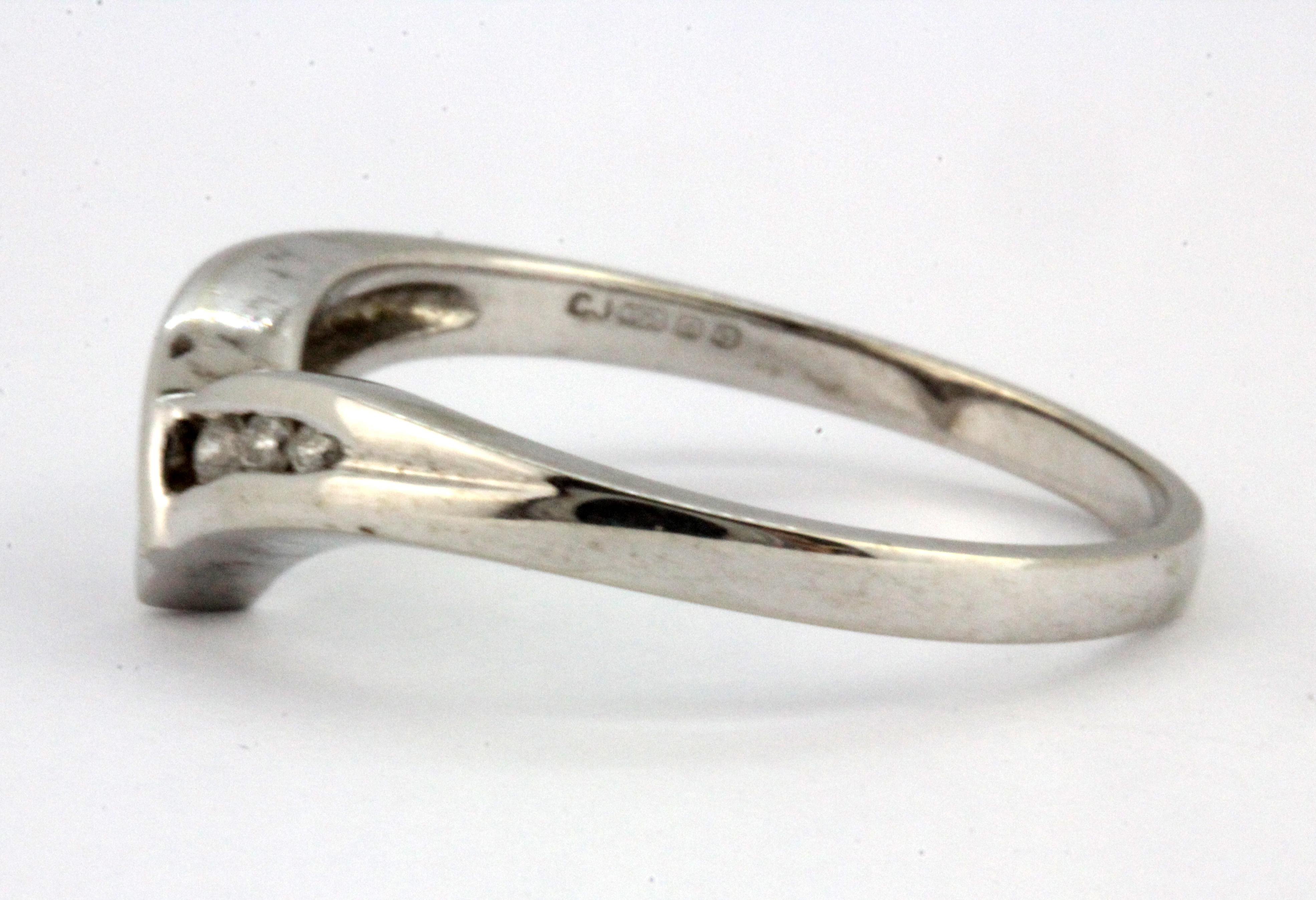 A 9ct white gold diamond set wishbone ring, (N). - Image 2 of 2