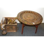 An Eastern brass topped folding table and a quantity of brassware.