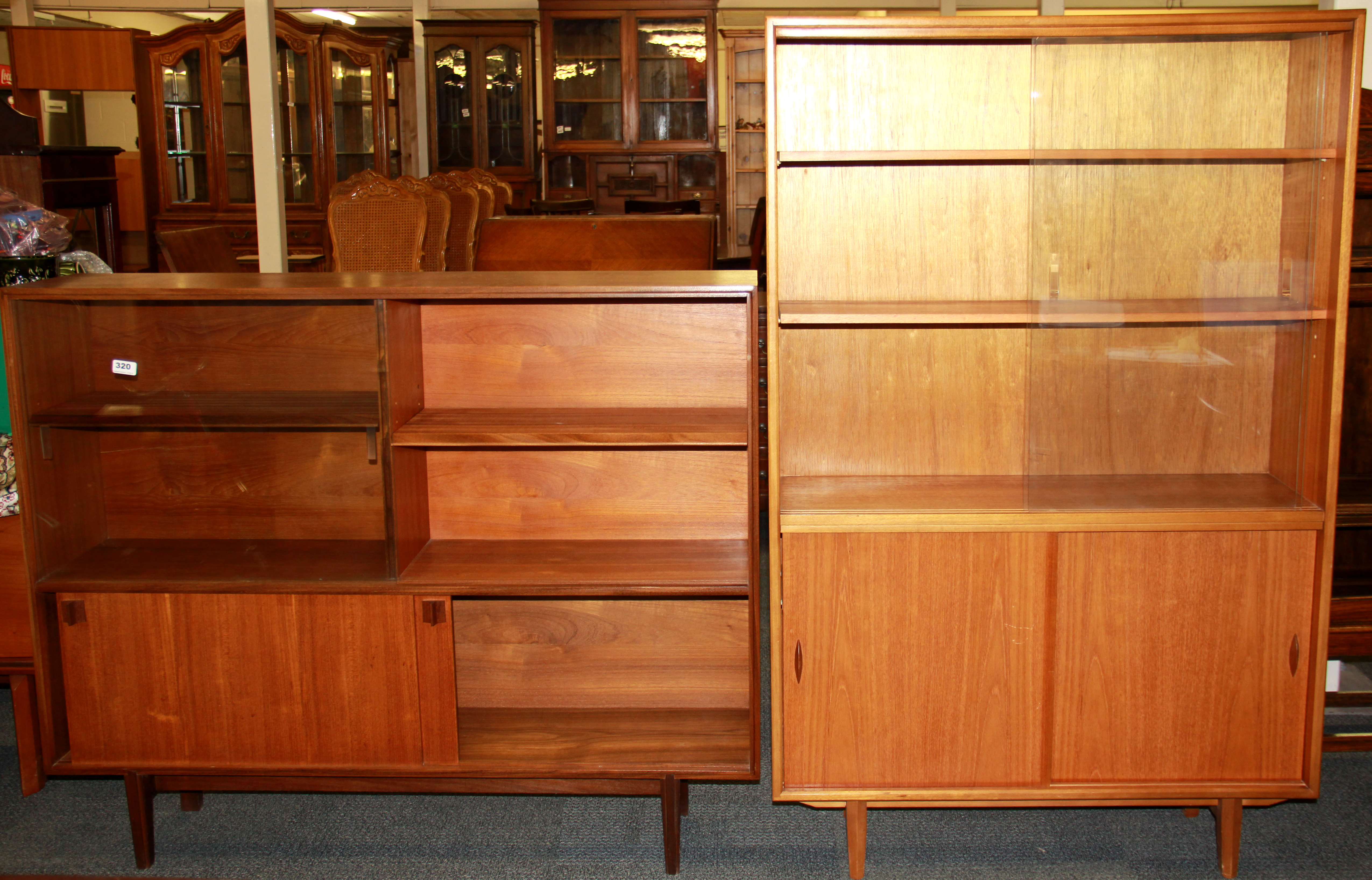 Two 1970's teak bookcases by Herbert E Gibbs Limited, sizes 122 x 101, 143 x 91cm.