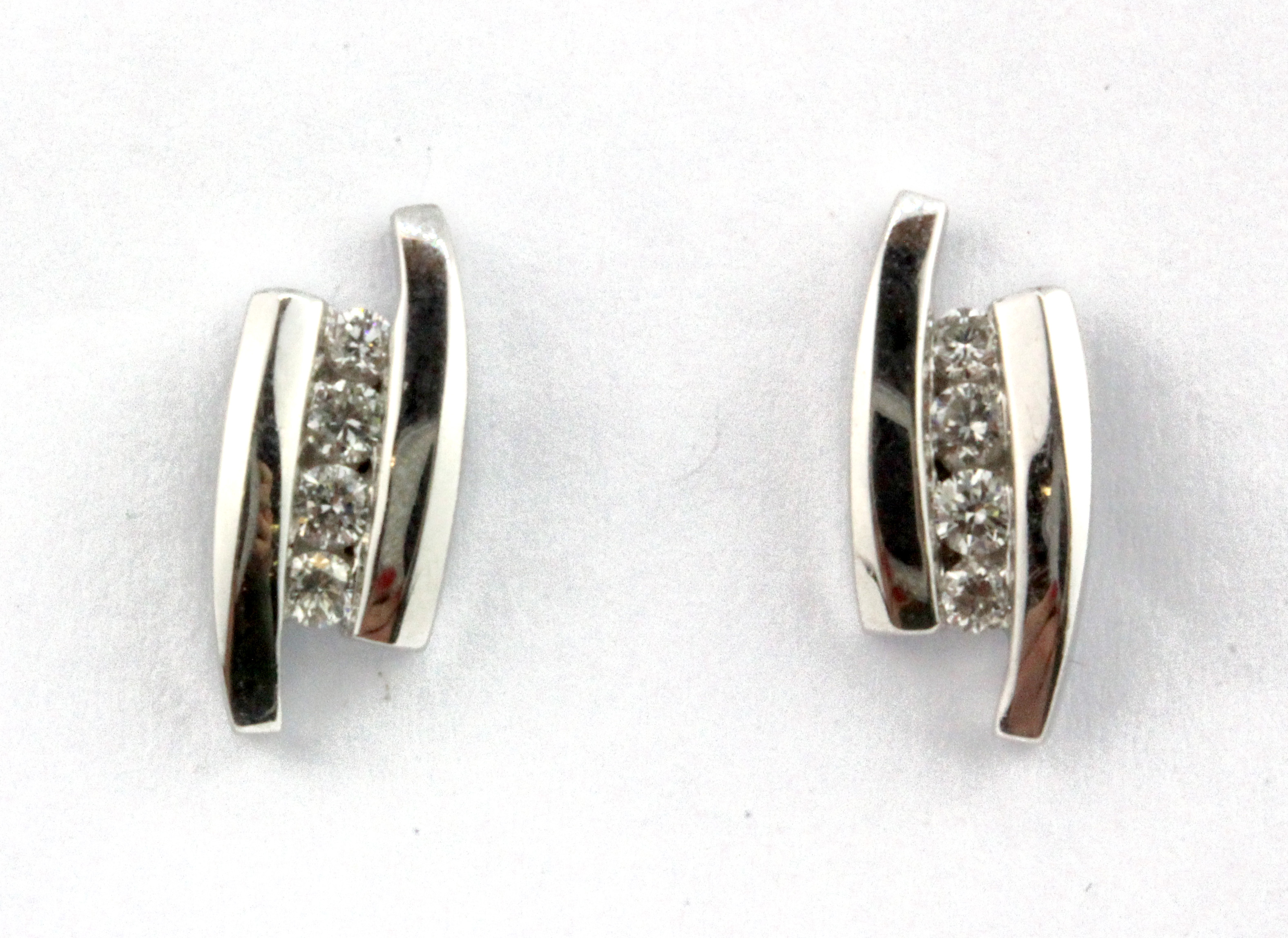 A pair of 18ct white gold diamond set earrings, L. 1.2cm.