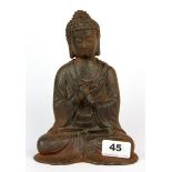 A Chinese cast iron figure of the seated Buddha, H. 20cm.