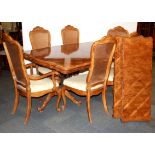 A large double pedestal oak marquetry and walnut veneered extending dining table and six cane backed