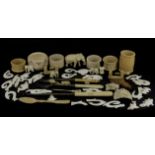 A group of mixed 19th and early 20th Century carved bone and ivory items.