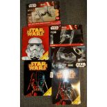 A group of boxed Star Wars collector's items.