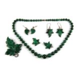 A malachite bead graduated necklace and a quantity of other white metal and malachite jewellery.