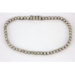 An 18ct white gold (stamped 750) diamond set line bracelet, approx. 2.75ct, L. 17.5cm.