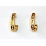 A pair of 9ct yellow gold diamond channel set earrings, L. 1.7cm.