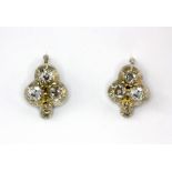 A pair of white metal earrings set with old cut diamonds, L. 1.3cm.