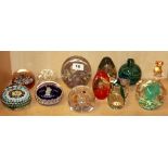 A group of mixed glass paperweights.