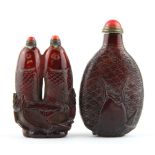 Two interesting Chinese carved faux amber fish snuff bottles, tallest H. 9cm.