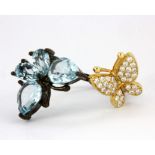 A 925 silver gilt adjustable ring set with pear cut Swiss blue topaz and cubic zirconia.