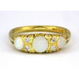 An antique 18ct yellow gold opal and diamond set ring, (O).