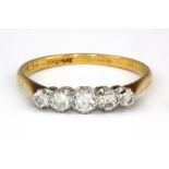 An 18ct yellow gold and platinum five graduated diamond set ring, (Q.5).