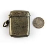A hallmarked silver vesta case containing a silver thrupenny piece, size 3.5cm.