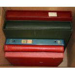 A box of mixed stamp albums.