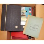 A box of mixed stamp albums.