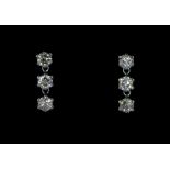 A pair of 900 platinum drop earrings set with brilliant cut diamonds, approx. 1ct overall, L. 1cm.