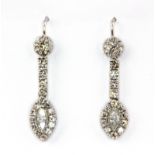 A pair of white metal (tested 18ct gold) drop earrings set with marquise and brilliant cut diamonds,