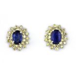 A pair of 925 silver cluster earrings set with oval cut sapphire and topaz, 3.2 x 3cm.