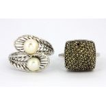 A 925 silver marcasite set ring and a white metal (tested gold plated silver) pearl set ring, (S.