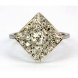 An 18ct white gold (stamped 750) diamond set cluster ring, (O.5).