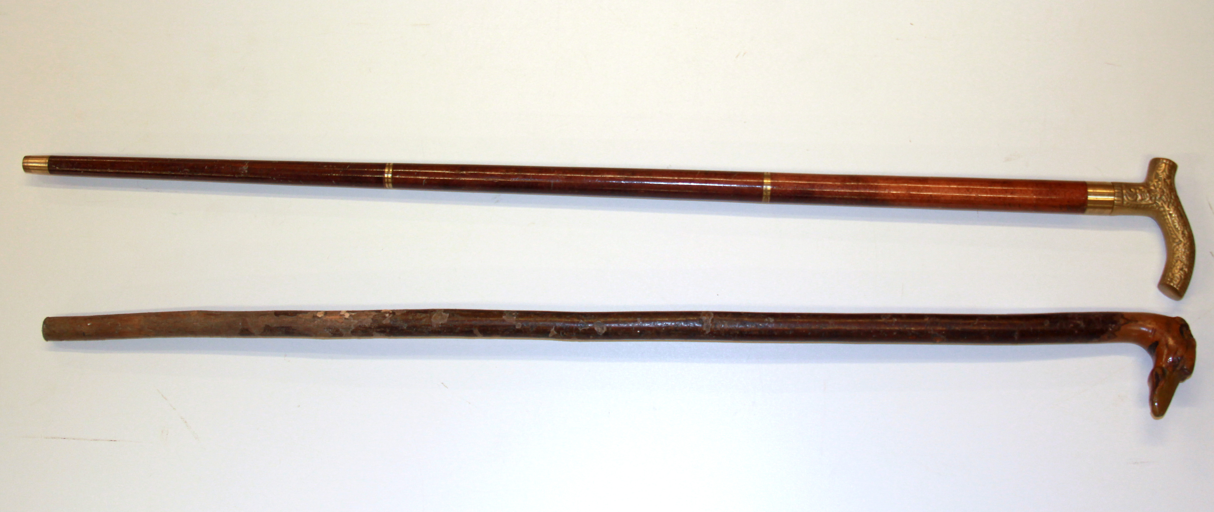 An interesting carved greyhound head walking stick and a modern brass handled walking stick - Image 2 of 3