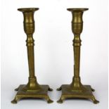 A pair of 18th century brass candlesticks, H. 23cm.
