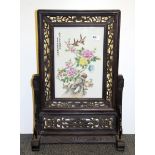 A Chinese carved hardwood mounted porcelain table screen, H. 67cm.