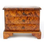 An attractive burrwood miniature three drawer chest, possibly an apprentice piece, size 13 x 16 x