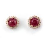 A pair of 925 silver rose gold gilt earrings set with cabochon cut ruby and white stones, Dia. 1cm.