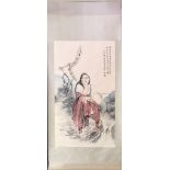 A Chinese silk mounted scroll painting of a girl beside a tree, size 82 x 215cm.