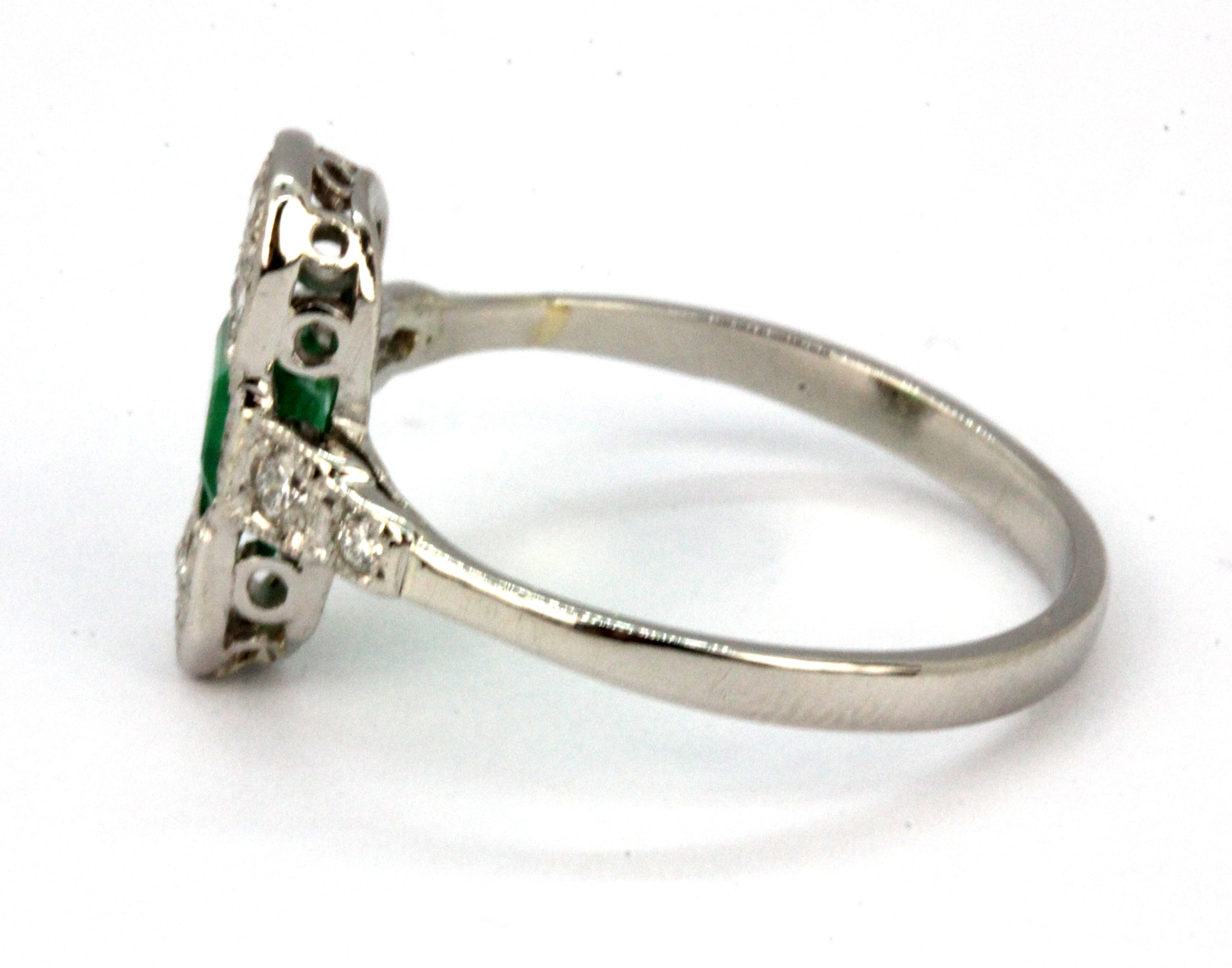 An Art Deco platinum ring set with a baguette cut emerald and brilliant cut diamonds, (P). - Image 2 of 2