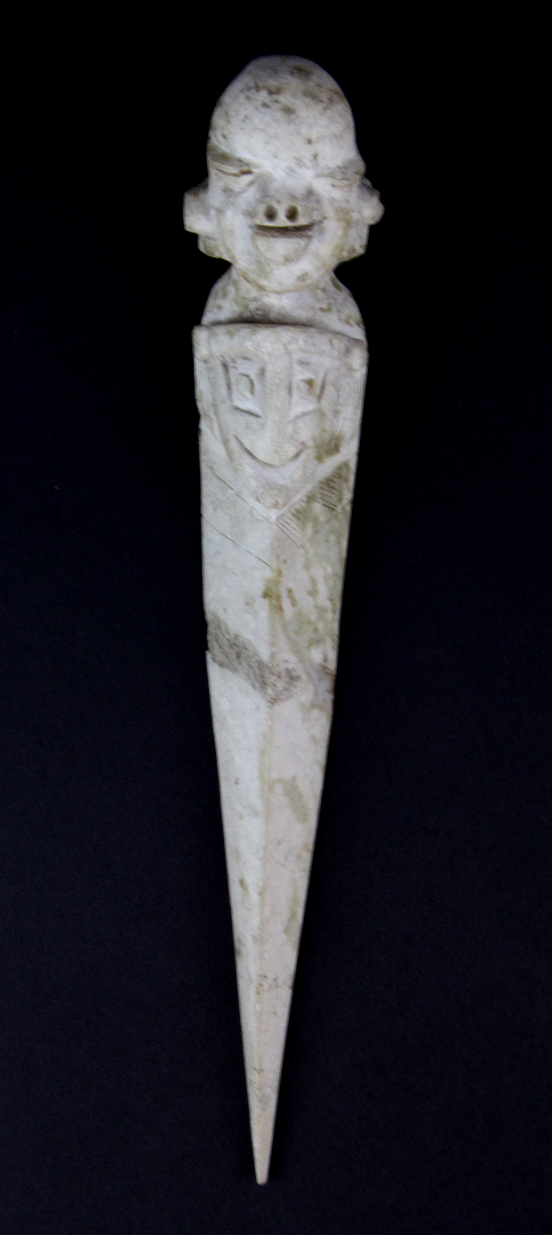 A Chinese archaic form carved jade ritual dagger, L. 22cm.