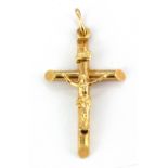 A 9ct yellow gold crucifix pendant, L. 4cm.