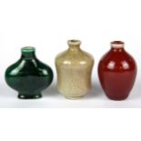 A group of three Chinese porcelain snuff bottles, H. 6cm.