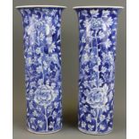 A pair of 19th Century Chinese hand painted porcelain cylinder vases, H. 31cm. With restoration to r