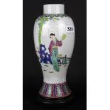 A Chinese early to mid 20th century hand enamelled porcelain vase on carved wooden stand, overall H.