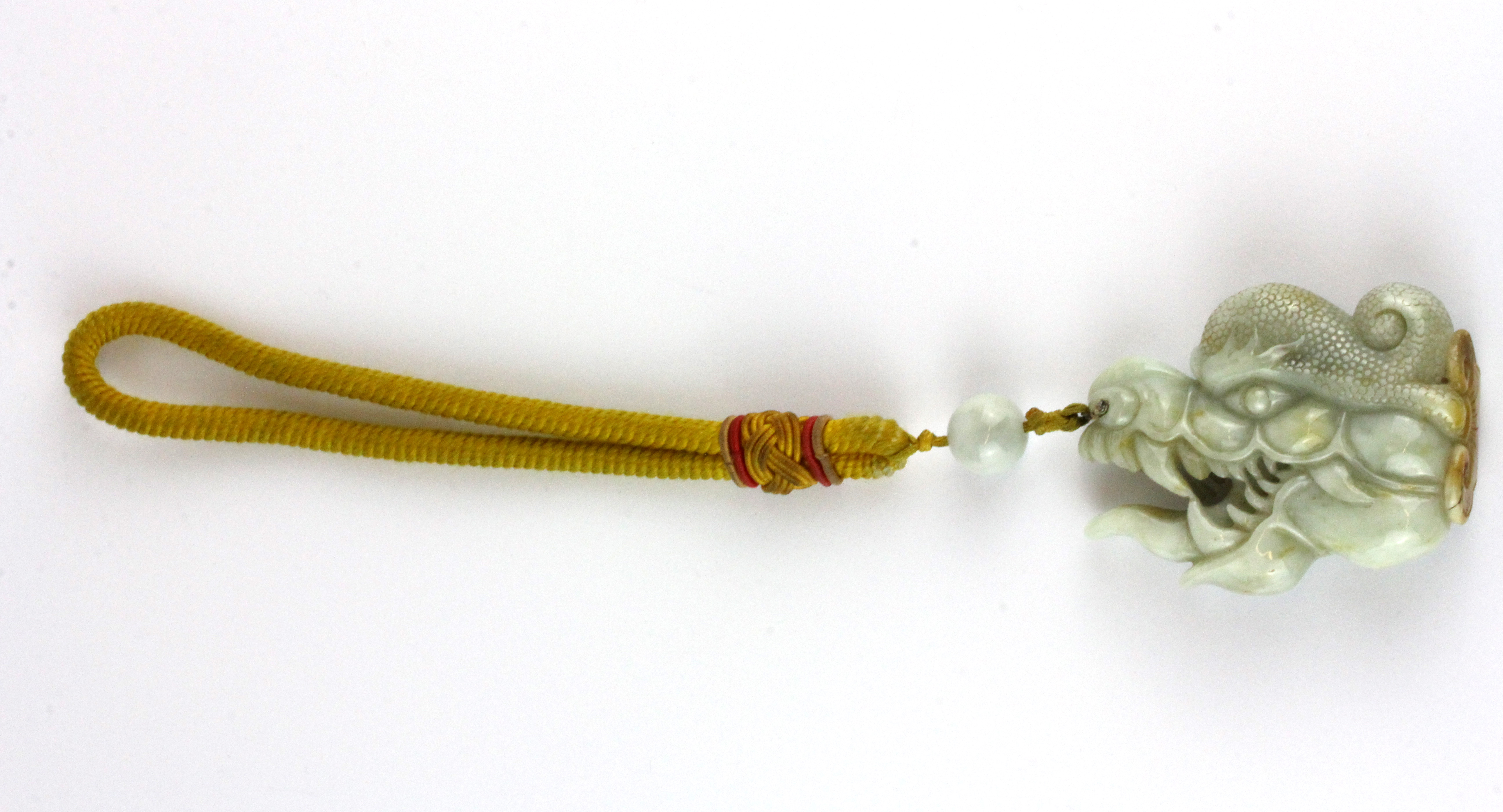 A superb 19th Century Sino-Tibetan carved jade protective amulet with Tibetan yellow silk carrying - Image 2 of 3